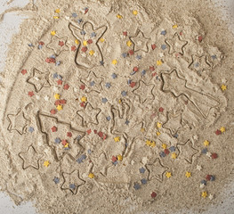 Abstract Christmas food background with cookies molds and flour