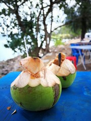 Enjoy the young coconut water at the beach of melano, kuching sarawak on 22nd July 2017