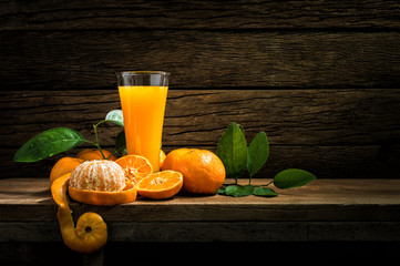 Still Life Glass of Fresh Orange Juice on Vintage Wood Table with Copy Space Background