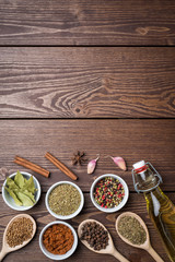 Fresh herbs and spices on wooden table. Close up
