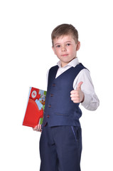 Schoolboy in blue suit with book in his hand thumbs up