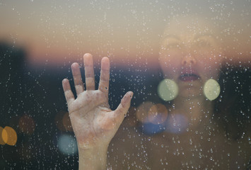 Double exposure of the female hand and face and the city of Malaysia