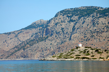 Fototapeta premium lighthouse on small island greece