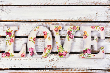 love background with decoupage decorated letters with rose pattern - obrazy, fototapety, plakaty