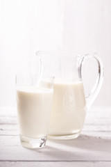 Obraz na płótnie Canvas Milk jug and glass milk