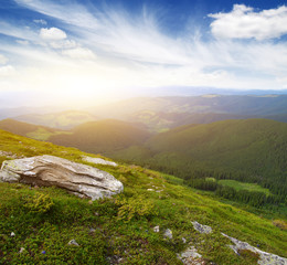 Naklejka premium Mountain landscape on sun