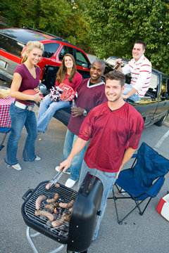 Tailgating: Smiling Group Waits For Tailgate Food To Cook