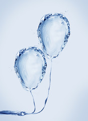 Fototapeta na wymiar Two blue balloons made of water.