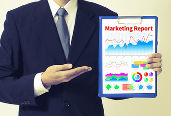 businessperson showing marketing report.