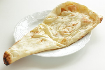 Indian food, naan bread on dish