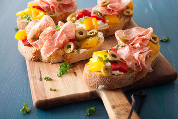 salami bruschetta with roasted peppers goat cheese olives