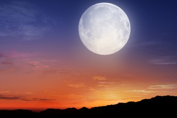 Red sunset and moon . Glowing sunset and full moon  . Dramatic nature background .Religion background