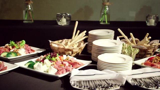Plates with salami and cheeses
