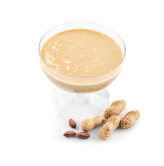 Peanut butter in glass dessert bowl on white background