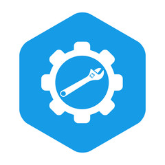 Icono plano engranaje con llave inglesa en hexagono azul