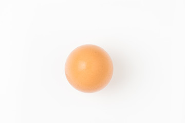 Single brown chicken egg on white background