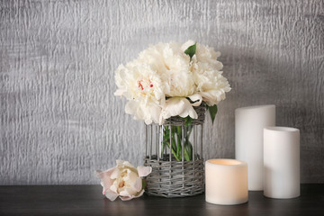 Vase with beautiful peonies on table