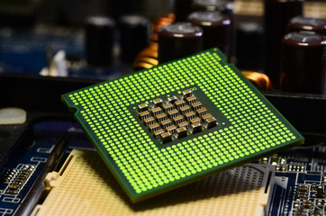 Close up of CPU Processor over Computer Motherboard. Tecnology background.