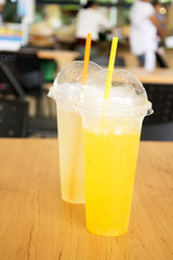 orange juice and Grapefruit juice in plastic cup at canteen.