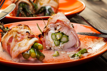 Baked fresh asparagus wrapped in chicken and bacon