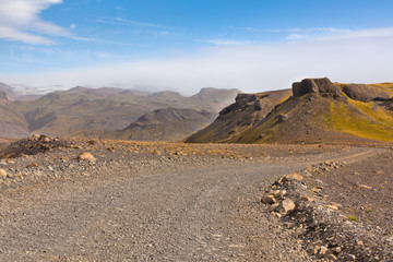 Gravel Road through Icelandic Lava mountains