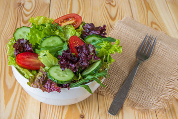 Fresh salad with mixed greens, cherry tomato and cucumber
