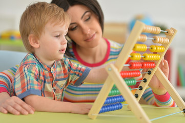 Young mother playing with son