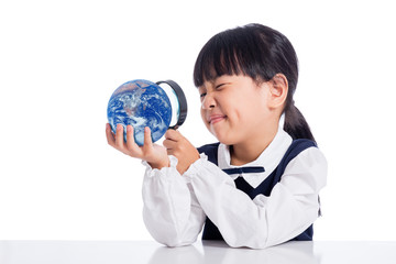 Fototapeta premium Asian Little Chinese Girl Looking At Globe Through Magnifying Glass