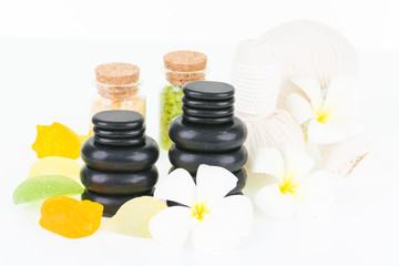 Obraz na płótnie Canvas Spa with hot stones, bath salt, herbal compress balls and seashell shaped soaps 