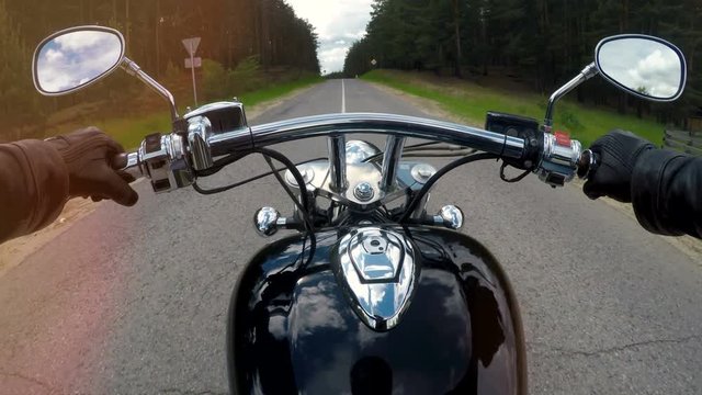 Fast motorcycle ride, handlebar close up.