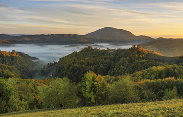 Stunning autumn nature with misty landscape,Holbav village,Carpathians,Transylvania,Romania,Europe