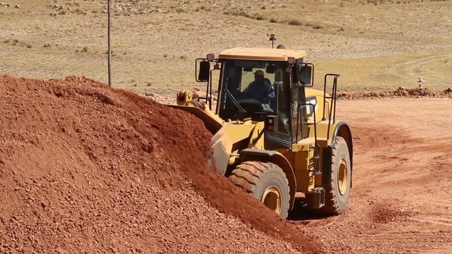Bulldozer moving soil