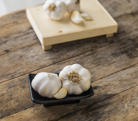 Garlic cloves on wooden vintage background. close up