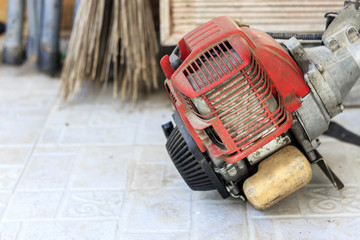 closeup lawn mower machine with soft-focus and over light in the background