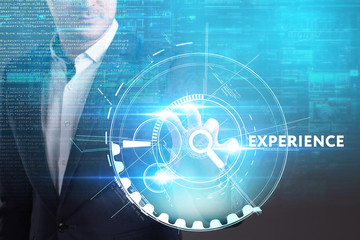 Business, Technology, Internet and network concept. Young businessman working on a virtual screen of the future and sees the inscription: Experience
