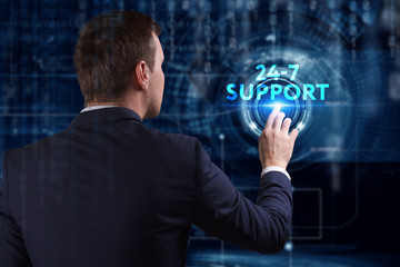 Business, Technology, Internet and network concept. Young businessman working on a virtual screen of the future and sees the inscription: 24-7 Support