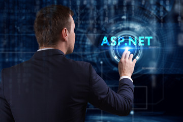 Business, Technology, Internet and network concept. Young businessman working on a virtual screen of the future and sees the inscription: ASP.NET