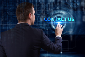 Business, Technology, Internet and network concept. Young businessman working on a virtual screen of the future and sees the inscription: Contact us
