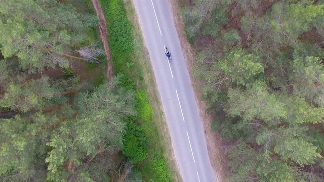 View from above of a biker riding his motorcycle.