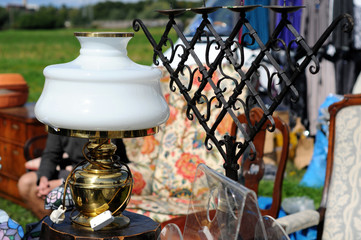 Fototapeta na wymiar old paraffin lamp with iron candle holder Flea market