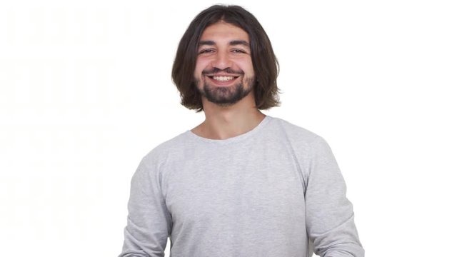 Caucasian guy with long hair showing ok isolated over white background. Concept of emotions