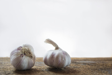  Two pieces of garlic on the wood