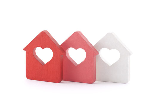 Three small houses with heart on white background