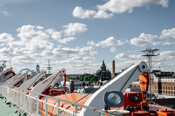 rescue boats on the ship on the background of the city