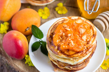 Delicious pancakes with apricots and honey.