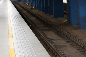 Fototapeta na wymiar Railway track at the Train station platform