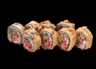 Japanese cuisine. Tempura sushi roll over dark background.