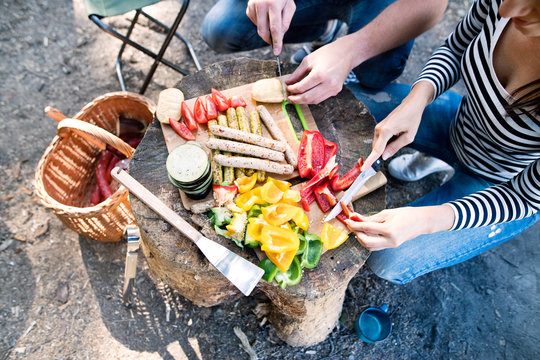 Unrecognizable Couple Camping In Forest, Preparing Food.