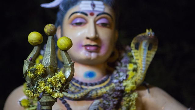 Lord Shiva holding a Trishul in Tiruvannamalai Temple near smashan.