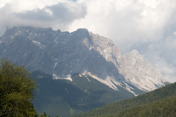 Stone peaks in the clouds and some trees
